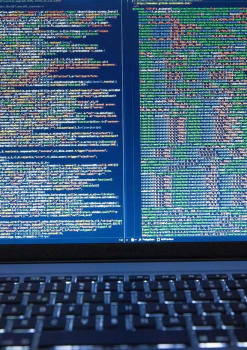 laptop with code on screen